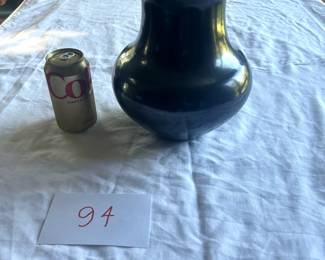 $7,500 - $10,000.	Maria Martinez blackware pot, fluted rim, signed "Poveka".  Measures approximately 9" by 10.5".