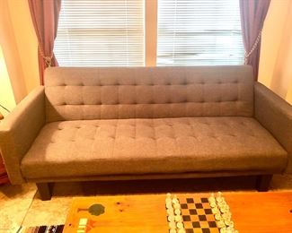 Grey tufted sofa with adjustable back 