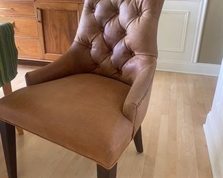 Restoration Hardware leather tufted chairs. Butter leather like your dad's (or grandfather's) briefcase. Still available online. MARTINE TUFTED LEATHER DINING ARMCHAIR
$2,180 / $1,637 Sale / $1,309 Member
Inspired by a French design, our solid oak Martine dining chair is elegant yet comfortable. A tufted back, curved silhouette and tapered legs lend timeless appeal. Set of 6  $3200 OBO. 