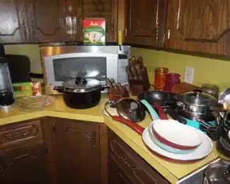 skillets, microwave, pots and pans, Soda machine, kitchen knives