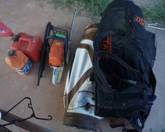 chain saw, golf bags, gas can