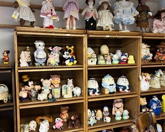 There are 8 oak lawyer stack bookcases, all as new. Each bookcase has collectible cookie jars, Fitz & Floyd, Treasurecraft, and Disney. Oak lawyer Cabinets retailed for around $1,200. leaded  glass on the top sections Asking price is $295.00.
