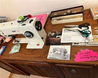 PFAFF sewing machine with cabinet. $225