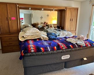 King size bed with nice Beauty rest  mattress. Oak cabinets on each side of the mirrored cabinet, can sell separately from bed. Matching dresser .Entire set is $850. Has a matching dresser that is priced at $75.00