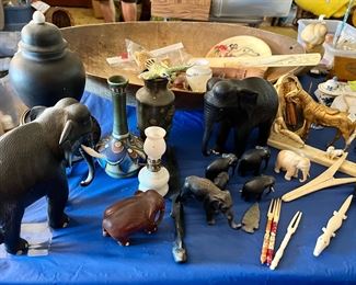 Vintage elephants with bone tusk and on toes Large ones are $30 and small one are $10 and the white elephant craved from bone is $50 
