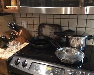 Partial Henkle knife set, 2 Lodge cast iron skillets, pressure cooker, Wagner baker