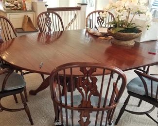 Classic Holland Macrae  dining table with multiple leaves (not shown) seats up to 12; chairs are Holland Macrae by Kravet