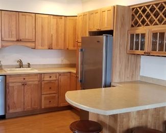 Pretty kitchen with nice quality wood cabinetry