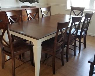 Made in Canada by Canadel, the top quality dining set seats 8