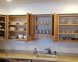 Kitchen cabinets are filled with glassware, serving ware and more! 