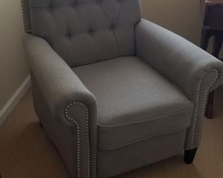 Classic arm chair is actually a recliner - sweet!