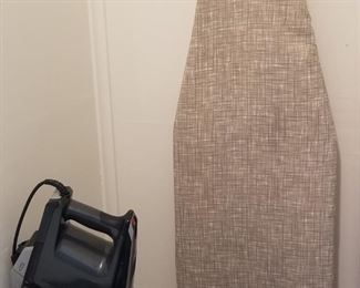 Ironing board; vacuum cleaner 