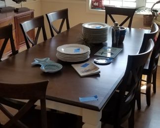 Made in Canada by Canadel, the top quality dining set seats 8