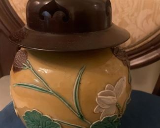 19th Century Chinese glazed yellow ginger jar with applied leaves, lotus, cranes and reticulated wooden lid. 8"h