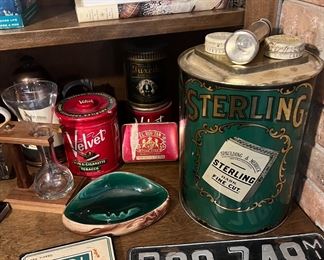 Tobacco tins and an abundance of fishing and outdoors related books