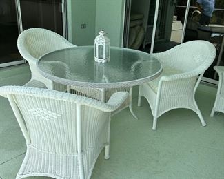 the 4th chair is on the porch