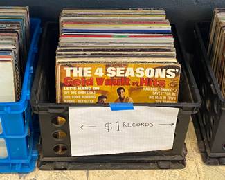 Three crates of $1 LP’s day one price 