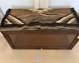 One vintage barrister's bookcase and Navajo weaving