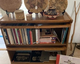 Antique barrister's bookcase with vintage baskets and Mesa Verde book collection