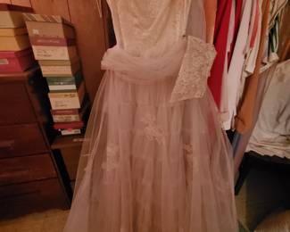 Many vintage dresses (in the basement bedroom)