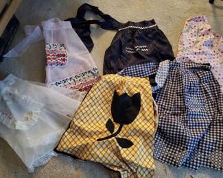 Numerous vintage aprons all like new!