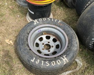 There are rims and racing tires all over the place!