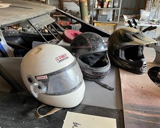 numerous racing helmets