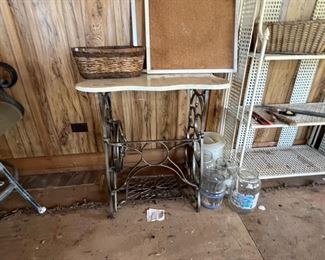 Inside the building we have an antique sewing machine base table