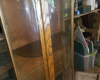 Oak bow front china, needs leg reinstalled. $150.00