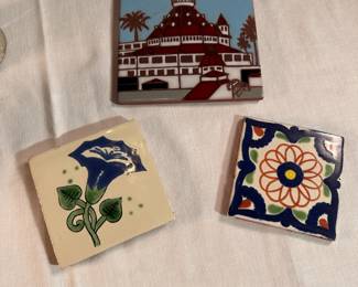 Three hand painted tile trivets, largest 6"W