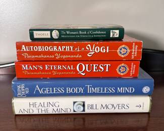 Group of books including Autobiography of a Yogi