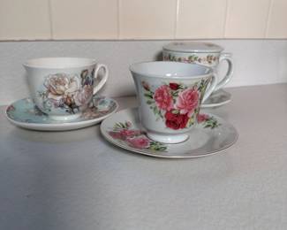 Three floral teacups and saucers