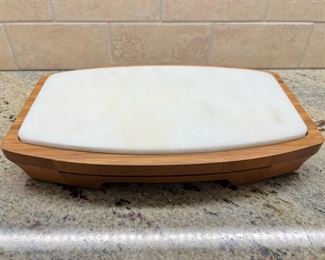 Teak cheese board with hidden drawer of serving utensils 