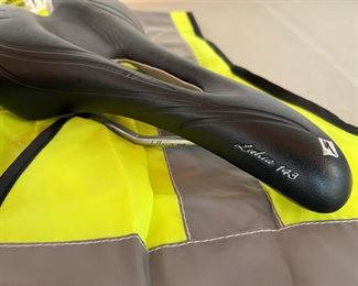 Biking accessories including a Like New Lithia 143 specialized GEL saddle