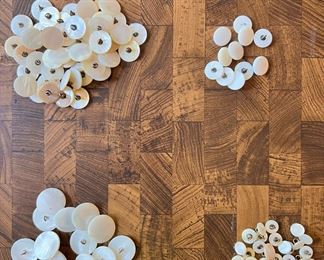 Various sized antique shell buttons