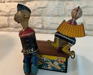 Vintage Marx tin litho Popeye & Olive Oyl on Roof.  As shown in the photos, Popeye is missing his arms and the original stem he would be attached to