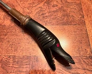 Gentleman’s riding crop with ebony wood animal face handle on a hidden “spear”.