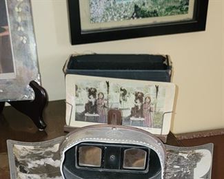Antique stereoscope with collection of cards
