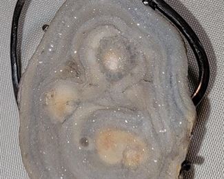Close-up of Hand-wrought sterling and rock pendant
