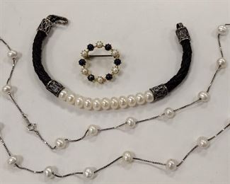 LEATHER AND PEARL BRACELET WITH STERLING CLASP AND ACCENTS.
STERLING NECKLACE WITH 23 SPACED PEARLS.
A CIRCLE PING MARKED '835', DOESN'T APPEAR TO HAVE PRECIOUS METAL CONTENT