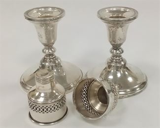A PAIR OF TOWLE WEIGHTED STERLING CANDLESTICKS. INCLUDES A PAIR OF THREADED INSERTS.  5 1/8" TALL.  SOME DENTS