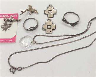     PAIR OF AR FETCHED CROSS PENDANTS
    TWO FIGURATIVE RINGS SIZE 5 1/2
    TWO CHARMS
    18" CHAIN