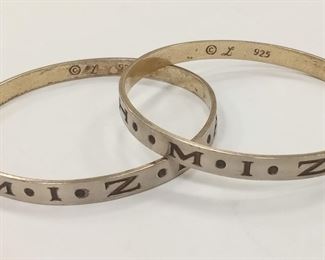 PAIR OF MARKED AND TESTED STERLING SILVER BANGLES.  EXTERIOR MONGRAMMED 'MIZPAH".  32.5 GRAMS.  INTERIOR GOLD PLATING WORN.
During the Victorian era, the practice of engraving  jewelry with the word “MIZPAH” grew in popularity. The word is Hebrew and means “watchtower”. A loose definition is “May God watch over you,” and the jewelry is meant to be given as a token of either love or friendship.  ESTIMATE $24.18
