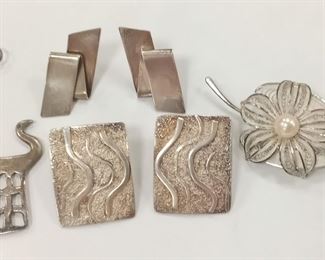 SILVER FILIGREE LEAF FORM PIN SET WITH SINGLE SALT WATER PEARL. MARKED 'SILVER' ON HANDLE,  TWO PAIRS OF STERLING EARRINGS FOR PIERCED EARS.  ONE SET NOT MARKED.  NO KEEPERS.  UNMARKED TESTED PENDANT IN THE FORM OF A  MYTHICAL ANIMAL.  2 1/8" TALL.
21.9 GRAMS
