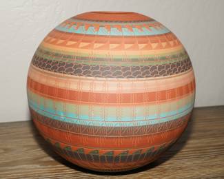 Multi-colored polychrome vessel by Navajo Anderson Smith.  This piece is about 12" tall. 