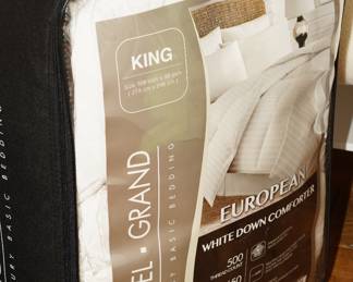 There are several very nice down comforters, shams, linens & quilts available for sale.