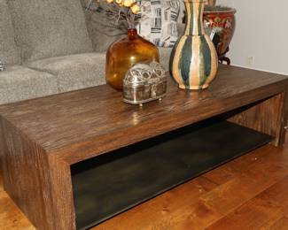 Restoration Hardware coffee table.  This piece matches the bookcase with the iron in the living room. 