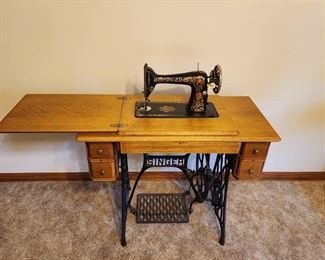Circa 1900 Singer Sewing machine complete with stand