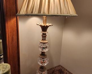 Tall glass and brass lamp