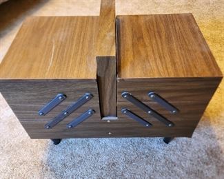 Vintage sewing box with supplies in it